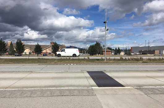 Cars pass the weigh-in-motion slab near the ID-41 exit on I-90 in Post Falls.