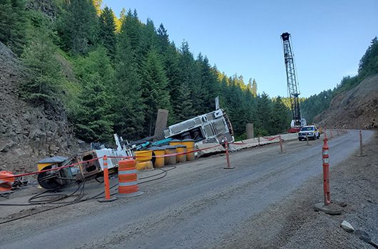 Photo of crane that fell June 29, 2019 while installing a temporary bridge for US-95 construction in Culdesac Canyon Phase 2.