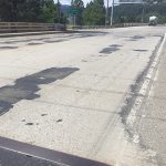 Deteriorating pavement on US-95 just north of Spokane River where it passes over Northwest Boulevard