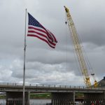 ID-55 bridge with american flag in foreground