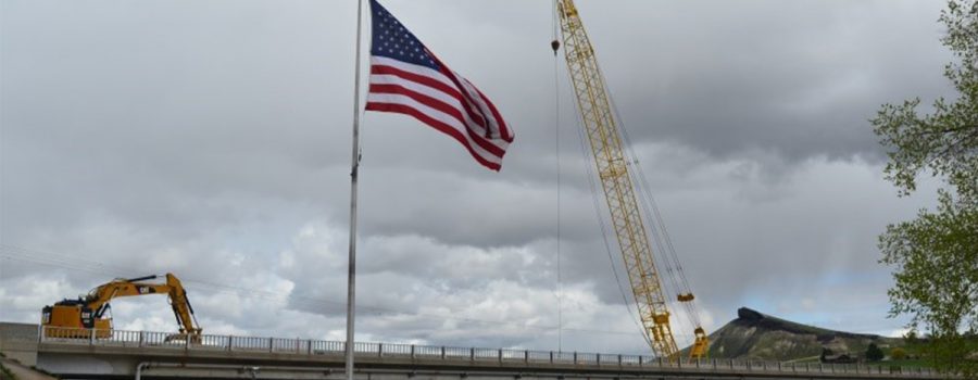 ID-55 bridge with american flag in foreground