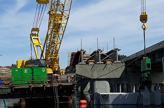 crane places girders for bridge