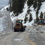 Two loaders clear an avalanche slide