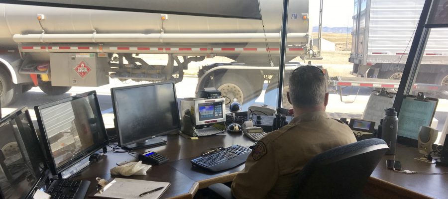 Inspector David Larsen looks on as trucks drive through the East Boise Port of Entry.