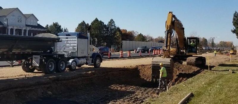 excavator besides roadway