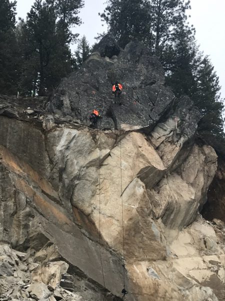 Geotechnical crew scaling the rockface