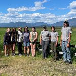 Volunteer group standing at the McArthur Lake Refuge