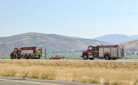 Fire trucks on the side of the road.