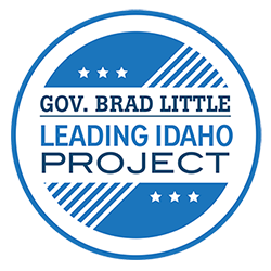 Blue and white circular logo for "Leading Idaho" projects sponsored by Governor Little
