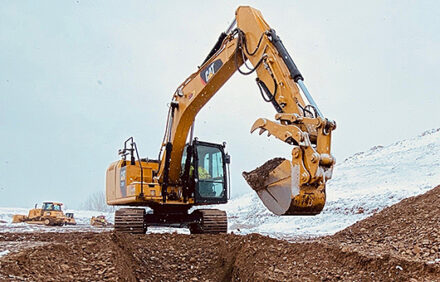 A backhoe digging a hole.