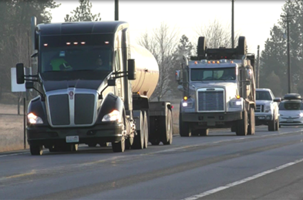 Long line of cars behind a truckLong line of cars behind a truck.