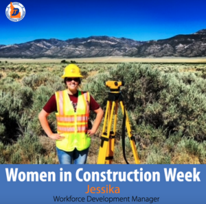 A woman in a hard hat and vest standing next to survey equipment.