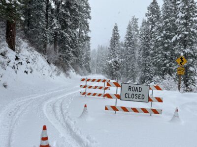 Barricades up to close SH-21 at milepost 48 in November of 2022
