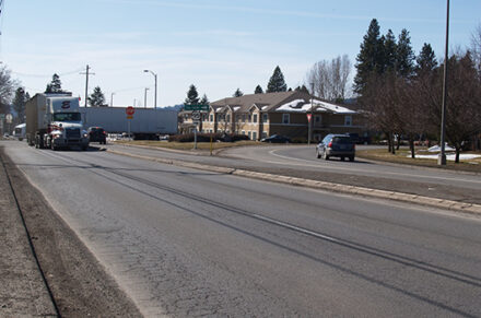 Large truck navigating a sharp corner on US-95
