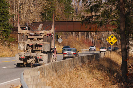 Traffic approaching a low overpass