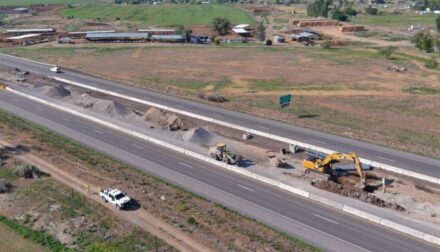 Construction in the median between two sides of the highway.