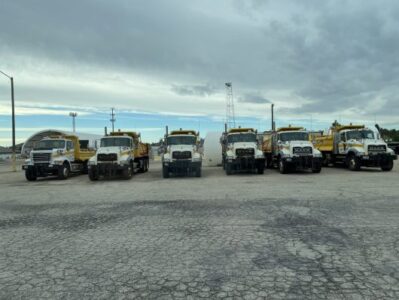 ITD dump trucks in a line.