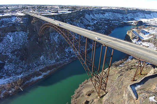 Drone shot of the Perrine Bridge with snow on the ground