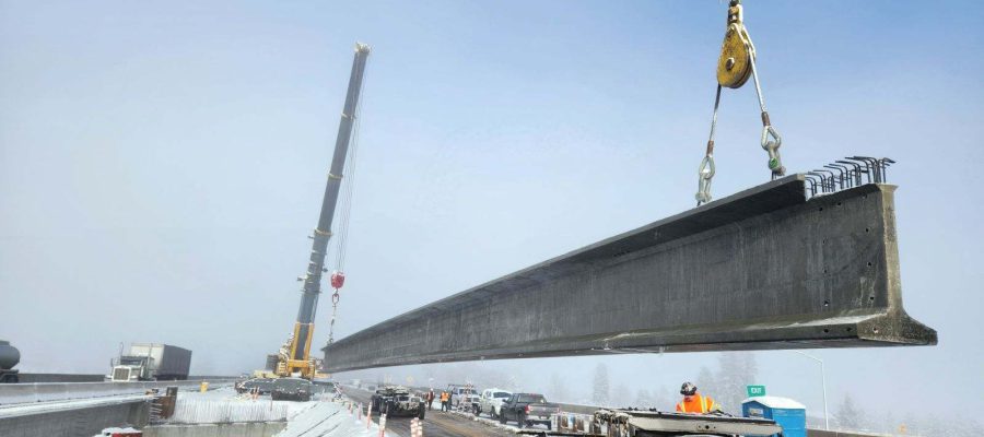 Large girder being set for a bridge on Interstate 90 in Post Falls
