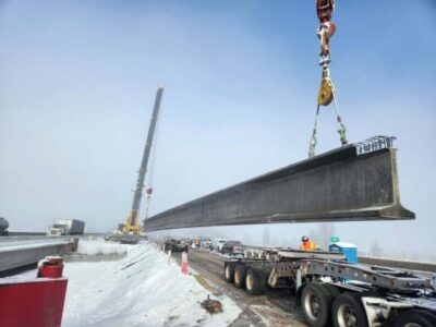Large girder being set for a bridge on Interstate 90 in Post Falls