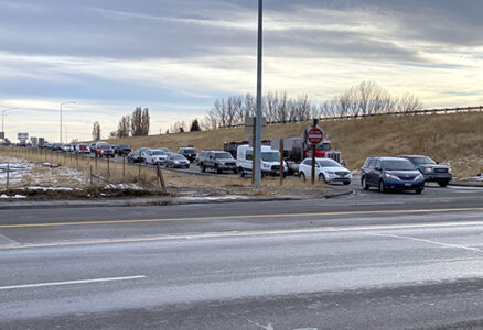 US-20 Rexburg Exit 332 line of cars stopped on ramp pre-construction of a new interchange design in 2024.