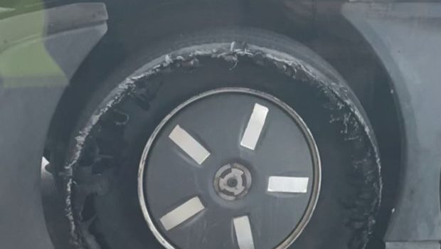 A damaged outside tire on a semitruck.