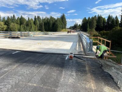 Construction crews work on new bridge surface on US-95 near McArthur Lake