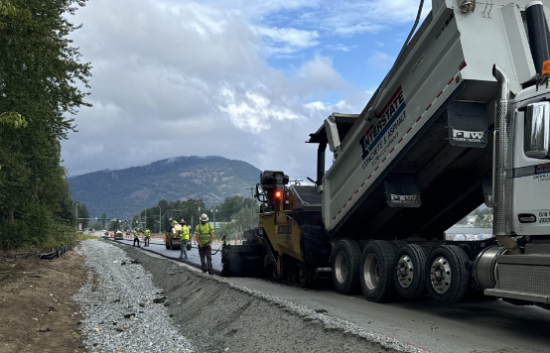 Crews work to pave a new section of SH-200 near Kootenai