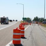 US-20 Exit 333 into Rexburg with construction markers and road closed barricades in place.