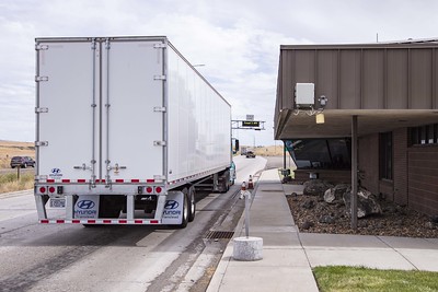 A semi truck next to the East Boise Port of Entry building.