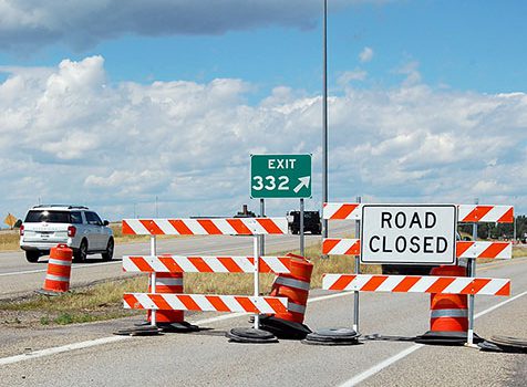 Road closed signs at Exit 332 on US-20 in Rexburg.