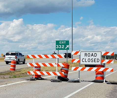 Road closed signs at Exit 332 on US-20 in Rexburg.