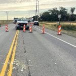 SH-33 with road blockades and a pickup truck following an accident