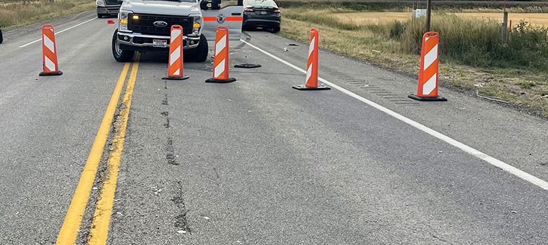 SH-33 with road blockades and a pickup truck following an accident