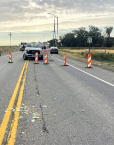 SH-33 in Newdale area road blockades and a pickup truck following a crash
