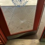 Broken door due to vandalism at Snake River Rest Area.