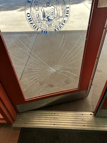 Broken door due to vandalism at Snake River Rest Area.