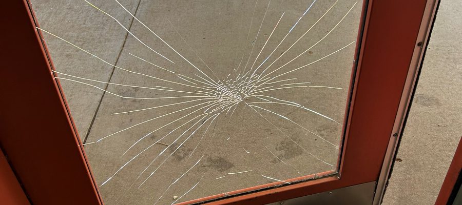 Broken door due to vandalism at Snake River Rest Area.