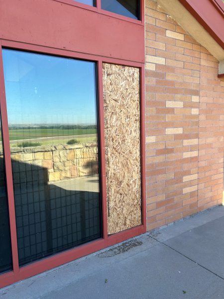 Broken window due to vandalism happening at the Snake River Rest Area.