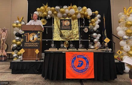 A podium surrounded by balloons.