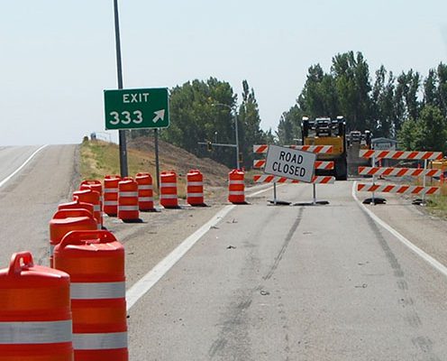 US-20 Exit 333 at Rexburg, road closed sign in place with construction equipment surrounding