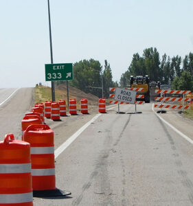 US-20 Exit 333 at Rexburg, road closed sign in place with construction equipment surrounding