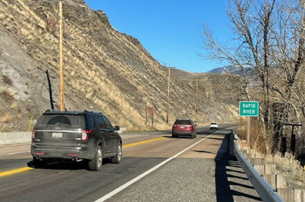 Several cars can be seen driving across the US-95 Rapid River bridge near Riggins.