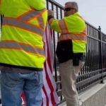 ITD hanging flags on the Cloverdale Overpass