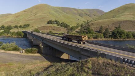 A logging truck crossing US-12 Arrow Bridge.