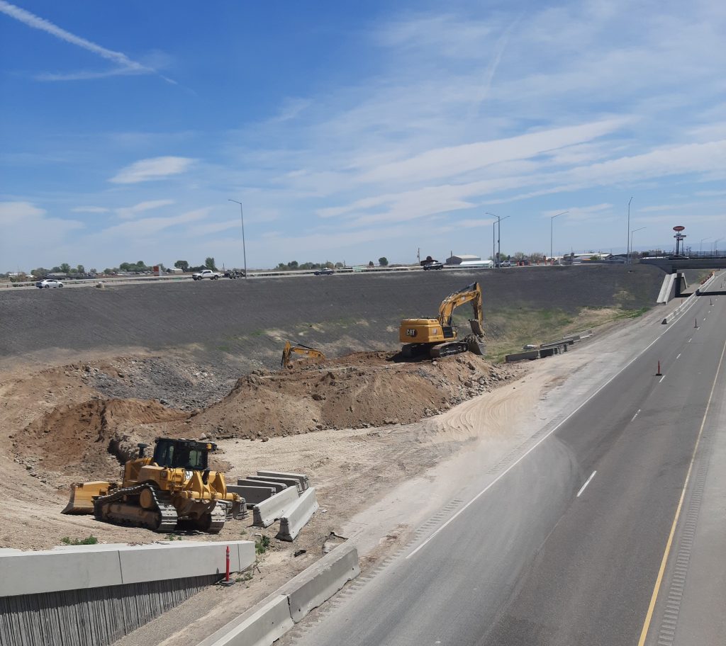 Photo of a bulldozer and an excavator at the South Jerome Interchange.