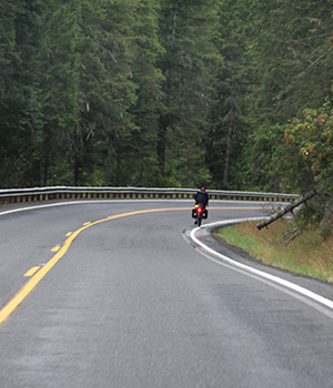 A bicyclist turns near the edge line on US-12.