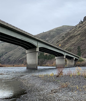 View of Arrow Bridge while walking the Clearwater River.