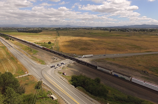 Overhead view of the SH-53 and Pleasant View3 intersection as a train passes.