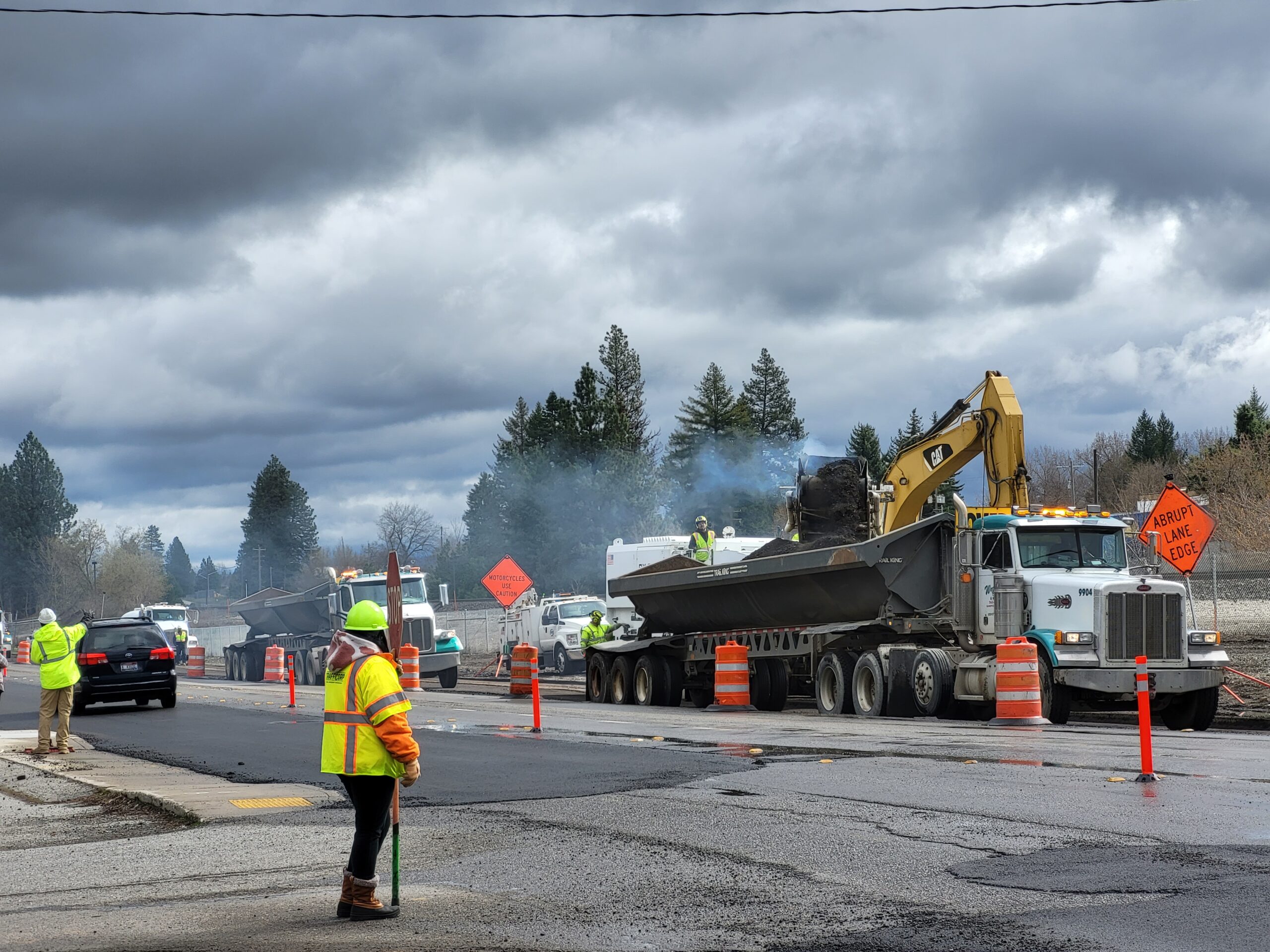 Grinding pavement from the existing roadway.